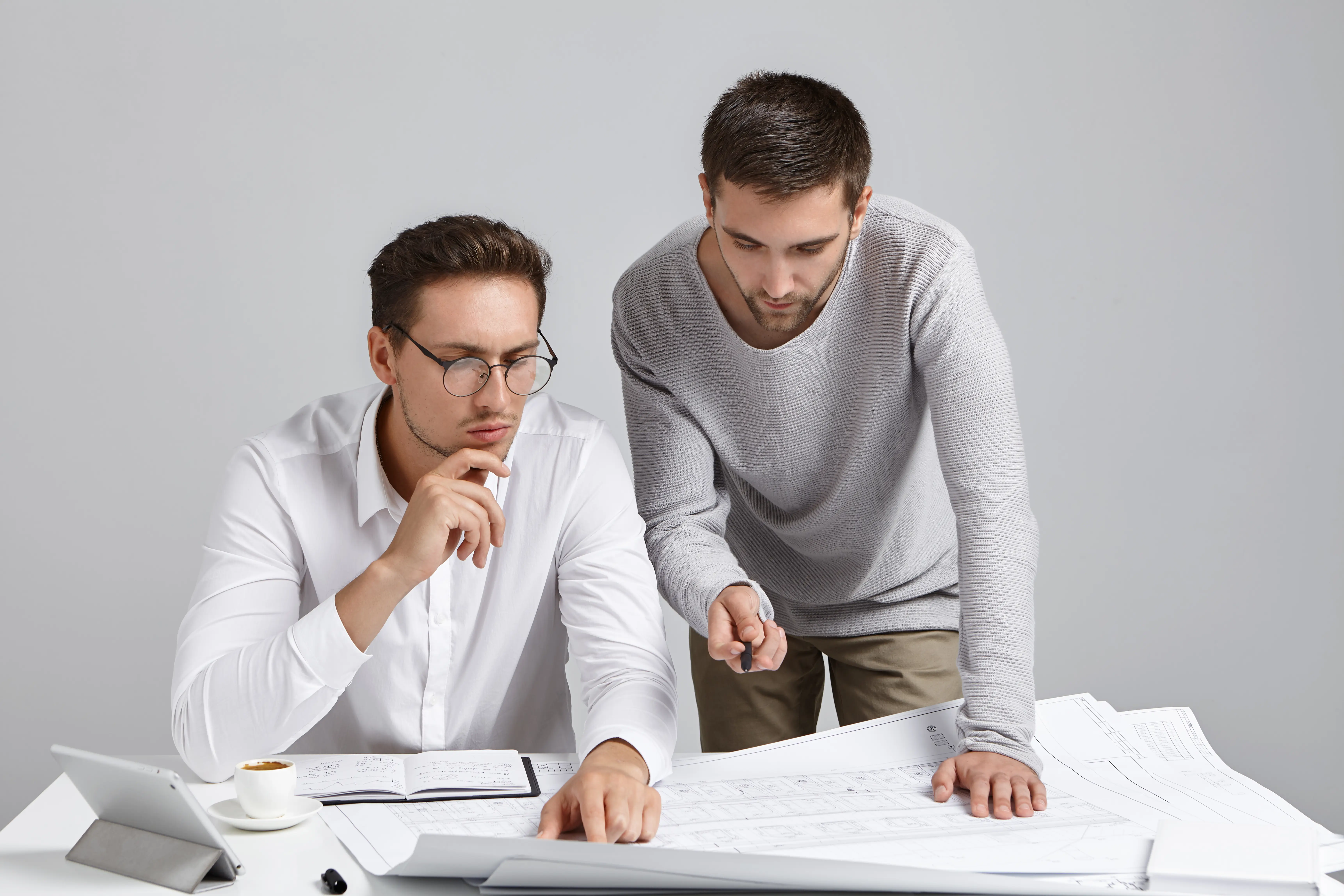 people-collaboration-discussion-concept-professional-architect-coworkers-look-attentively-blueprint.webp